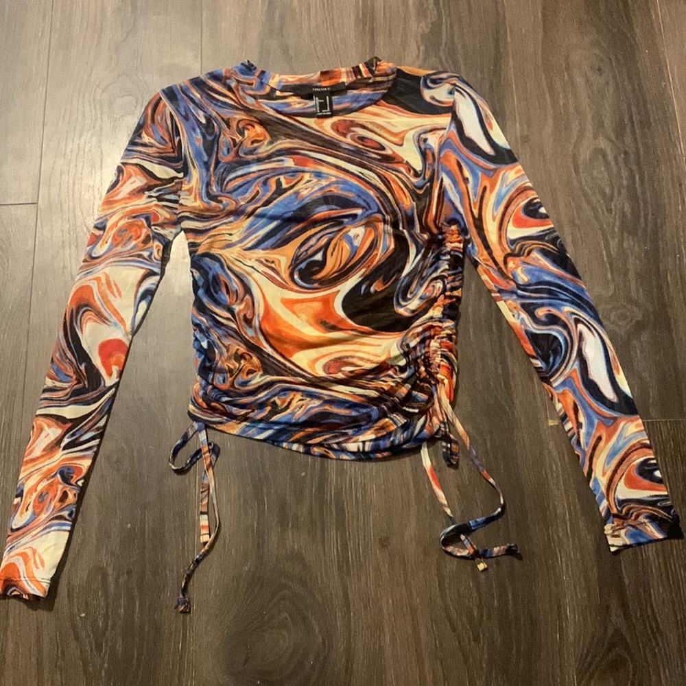 Long sleeve mesh top ! Very trendy and can UPGRADE and outfit.